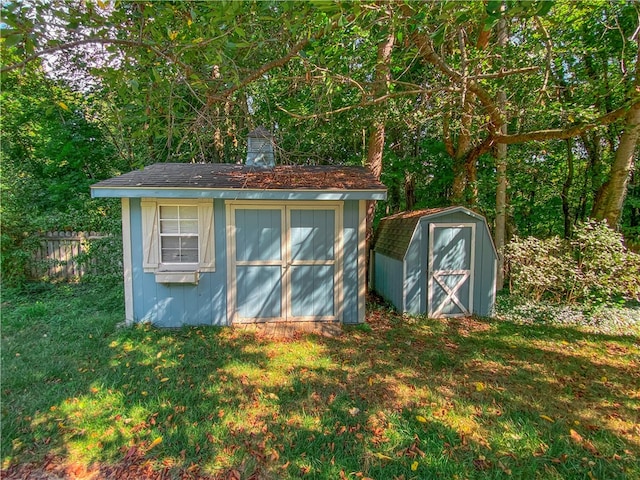 view of outdoor structure featuring a lawn