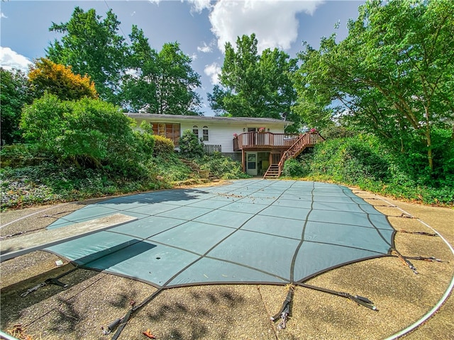 view of swimming pool featuring a wooden deck