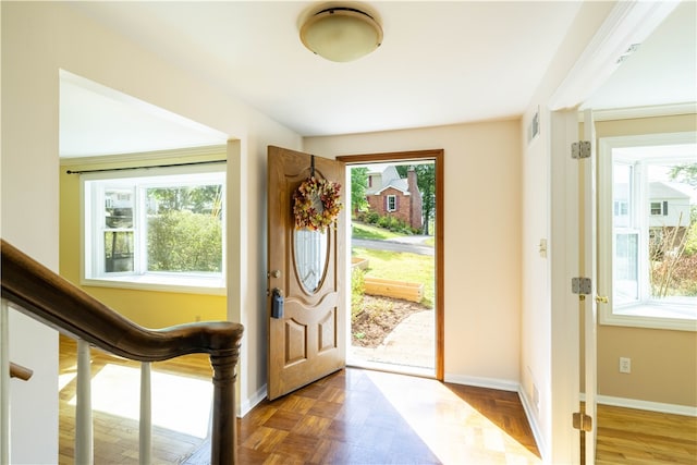 foyer entrance with parquet flooring