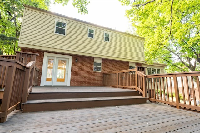 back of property featuring a wooden deck