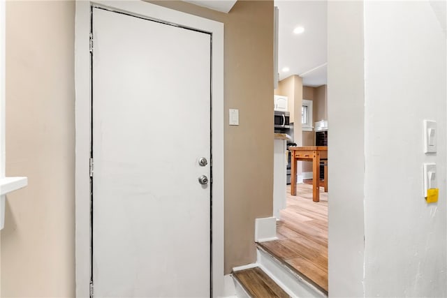 doorway featuring wood-type flooring