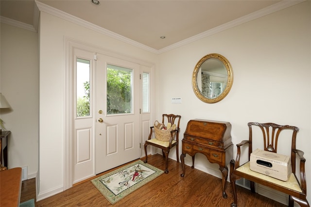 entrance foyer with ornamental molding and wood-type flooring