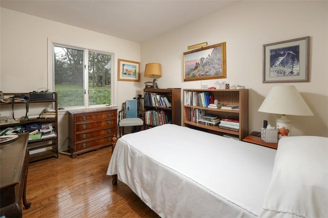 bedroom featuring wood finished floors