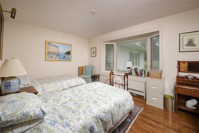 bedroom with wood finished floors