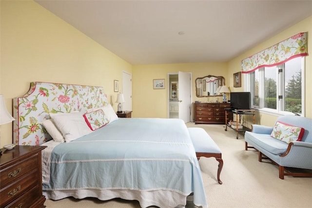 bedroom featuring carpet flooring and ensuite bathroom