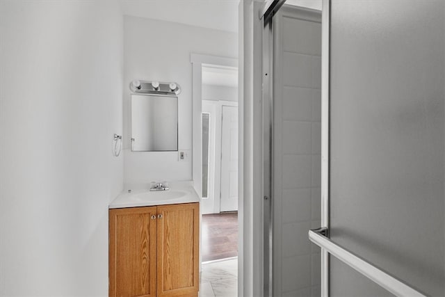 bathroom featuring hardwood / wood-style floors and vanity