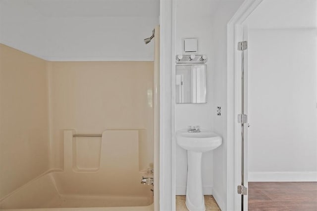 932 Gaskill Ave, Jeannette, PA 15644 - full bathroom featuring  shower combination, baseboards, and a sink