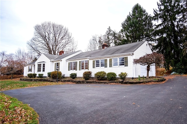 ranch-style home featuring a garage