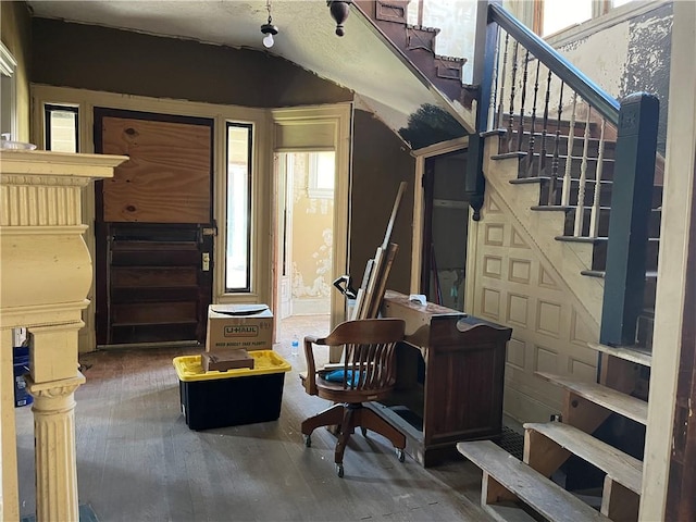 foyer with stairway and wood finished floors