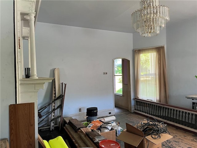 living area featuring a notable chandelier