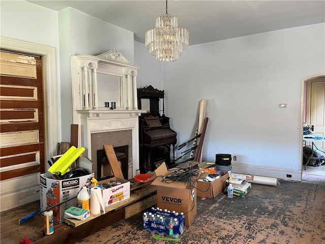 interior space with hardwood / wood-style flooring, an inviting chandelier, and a premium fireplace