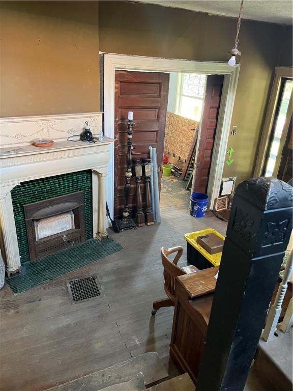 living room with wood finished floors and visible vents