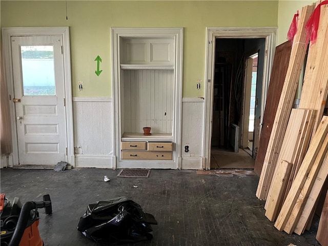 interior space featuring a wainscoted wall