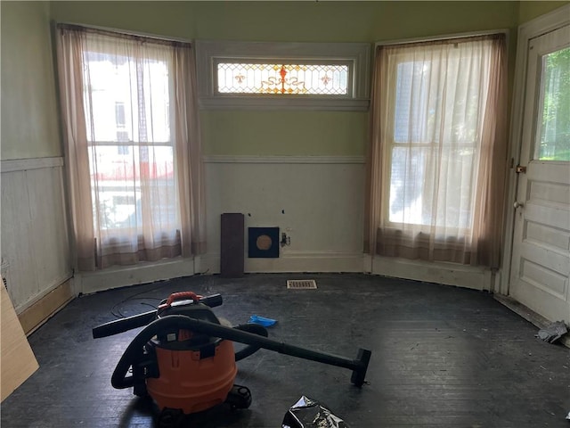 living room featuring a wainscoted wall