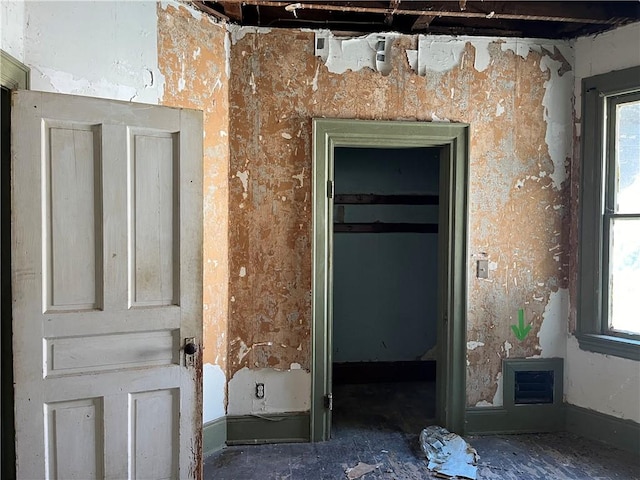 hallway featuring a wealth of natural light
