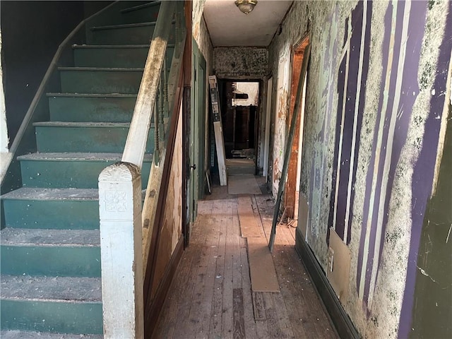 stairs with hardwood / wood-style floors