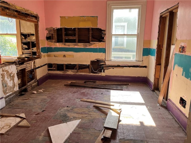 interior space featuring plenty of natural light and baseboards