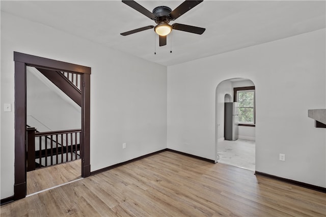 spare room with light hardwood / wood-style flooring and ceiling fan