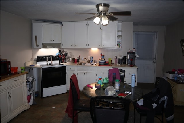 kitchen with white electric stove, ceiling fan, and white cabinets