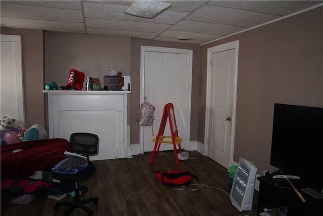 home office featuring a paneled ceiling and hardwood / wood-style flooring