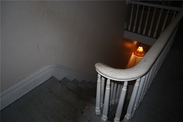 stairway with hardwood / wood-style floors