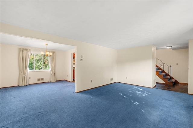 unfurnished living room featuring dark colored carpet and a notable chandelier