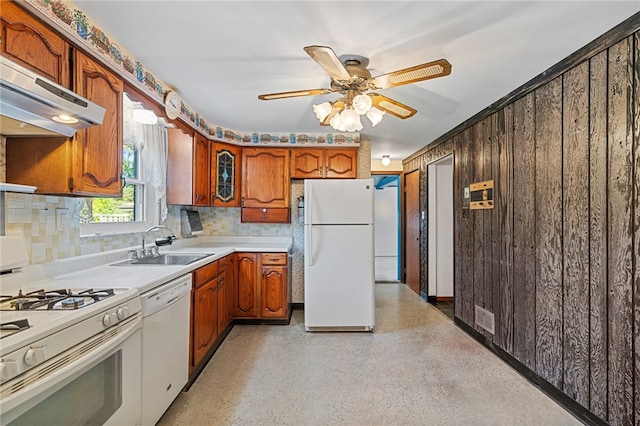 kitchen featuring white appliances, backsplash, range hood, sink, and ceiling fan