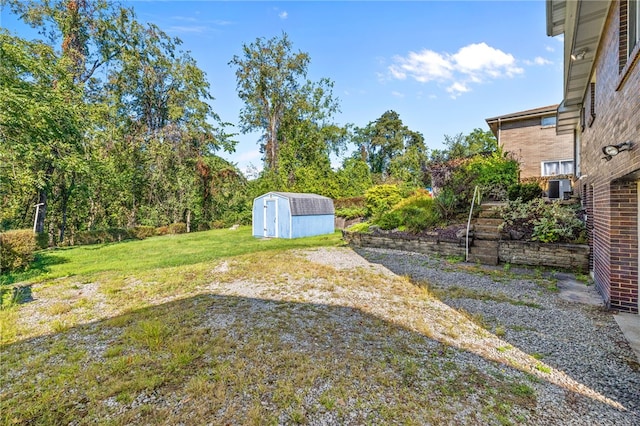 view of yard with central AC unit and a shed