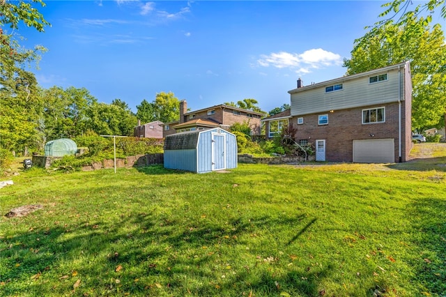 view of yard with a garage and a shed