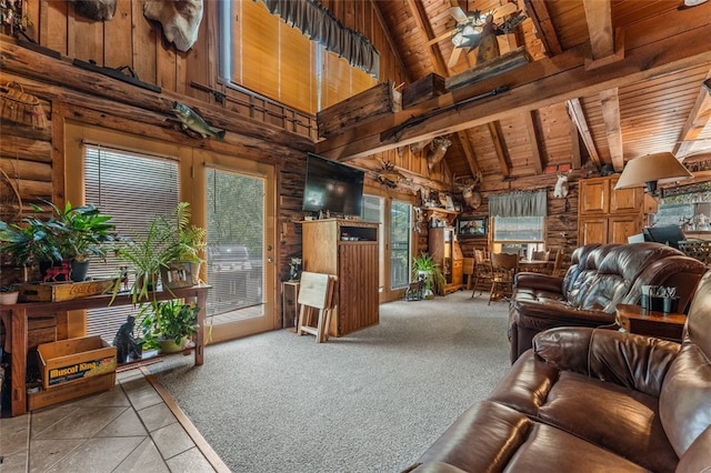 carpeted living room featuring high vaulted ceiling, wooden walls, beamed ceiling, and wooden ceiling