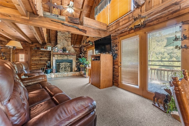 living room featuring a fireplace, carpet flooring, wood ceiling, ceiling fan, and beam ceiling