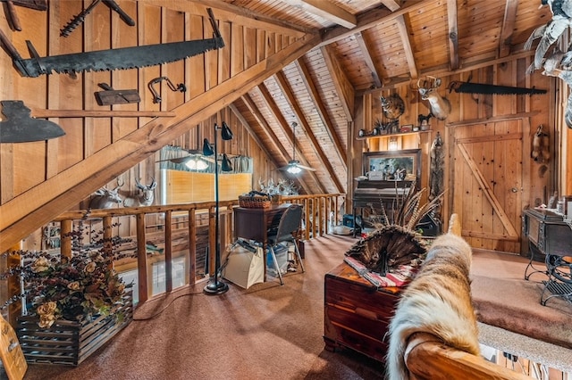 interior space featuring wood walls, wood ceiling, carpet, and lofted ceiling with beams