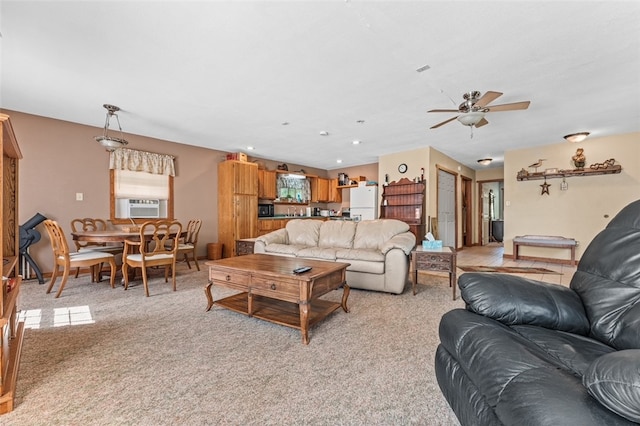 living room featuring cooling unit, ceiling fan, and light carpet