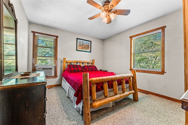 bedroom featuring cooling unit, carpet, and ceiling fan