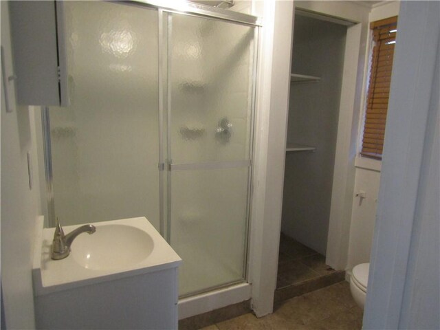 203 W George, Carmichaels/Cumblnd, PA 15320 - bathroom with vanity, toilet, a stall shower, and tile patterned floors