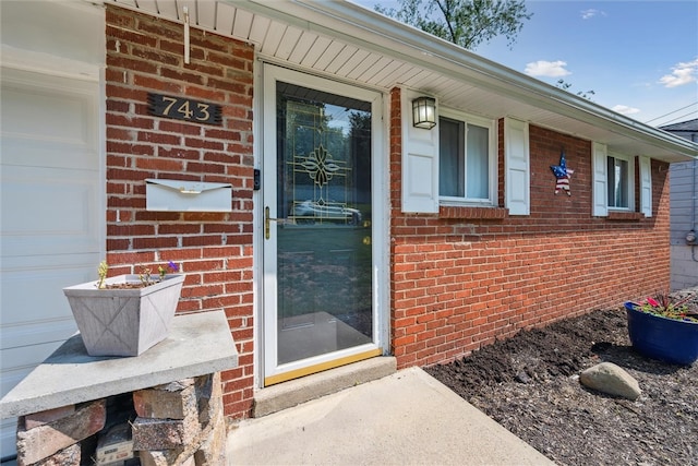 property entrance with a garage and a porch