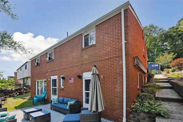 back of property with outdoor lounge area