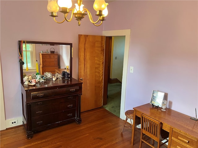 interior space featuring dark wood-type flooring and a notable chandelier