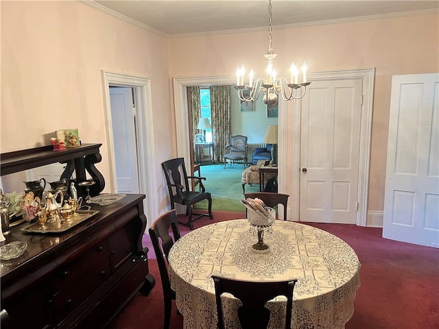 dining space featuring crown molding, dark carpet, and an inviting chandelier