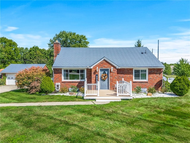 view of front of house with a garage and a front yard