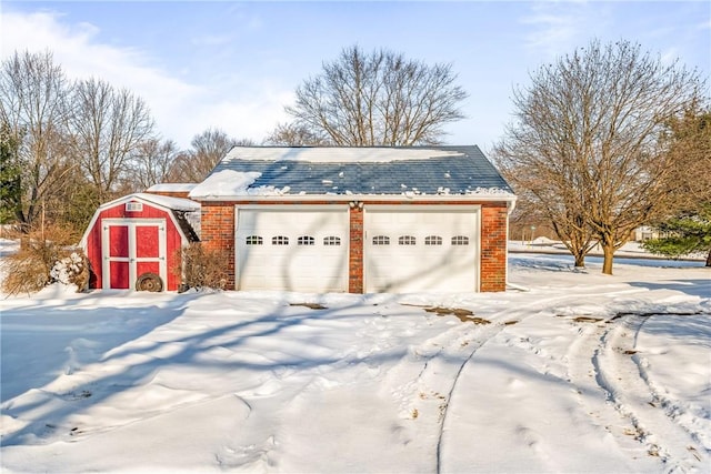 view of snow covered garage