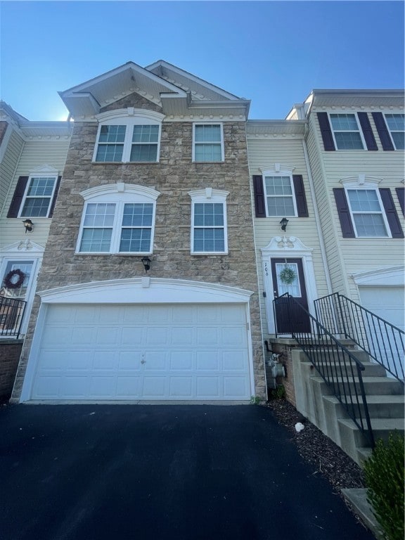 townhome / multi-family property featuring a garage