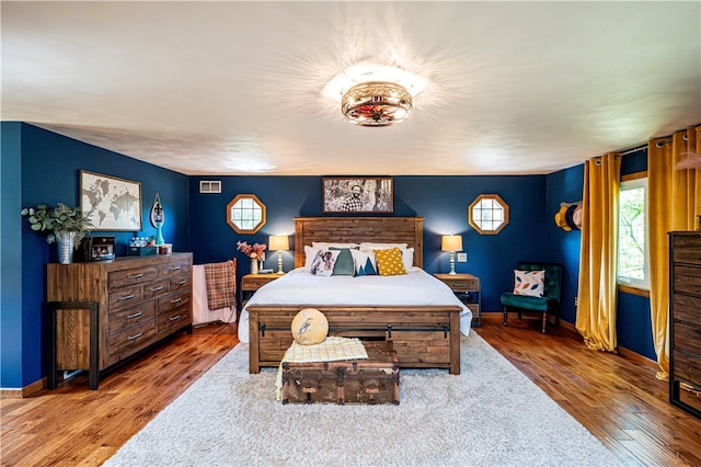 bedroom with wood-type flooring