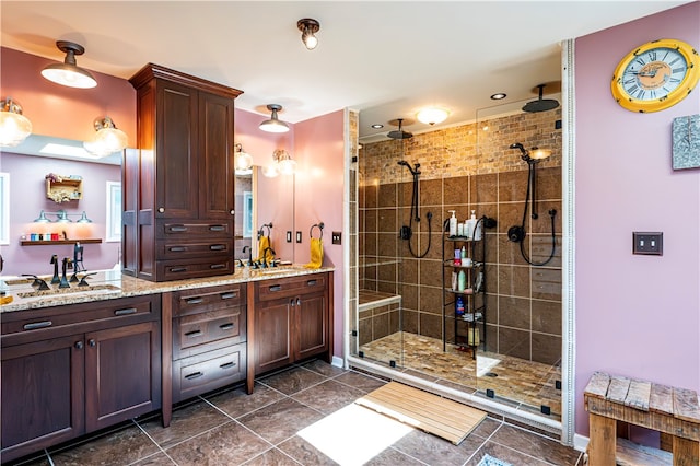 bathroom with walk in shower and vanity