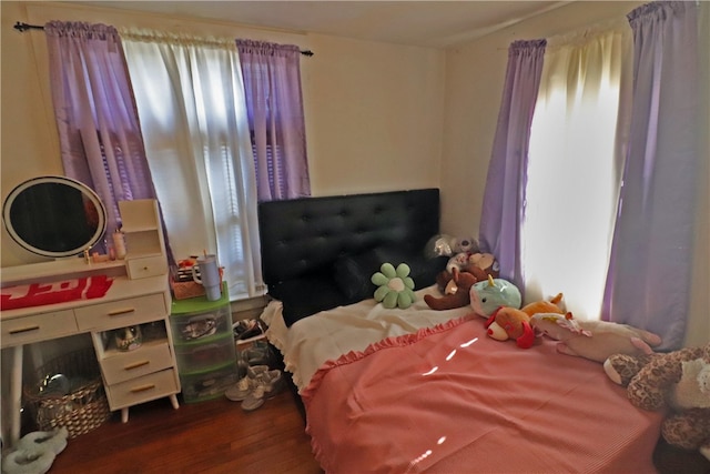 bedroom featuring dark hardwood / wood-style flooring