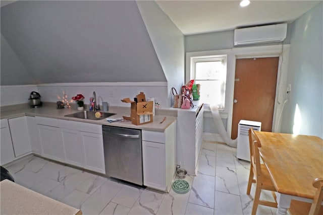 kitchen featuring dishwasher, sink, an AC wall unit, and white cabinets