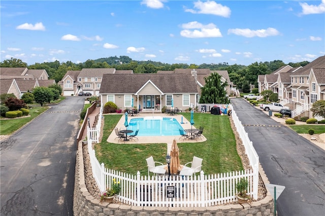 view of pool featuring a yard