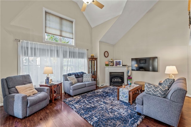 living room with high vaulted ceiling, ceiling fan, and dark hardwood / wood-style floors