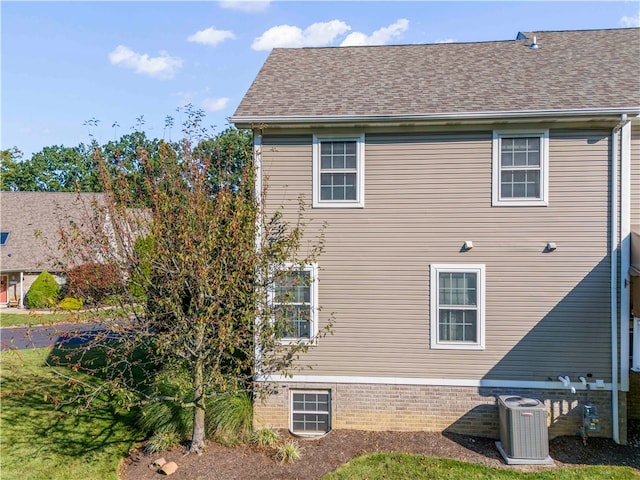 view of home's exterior featuring central AC unit