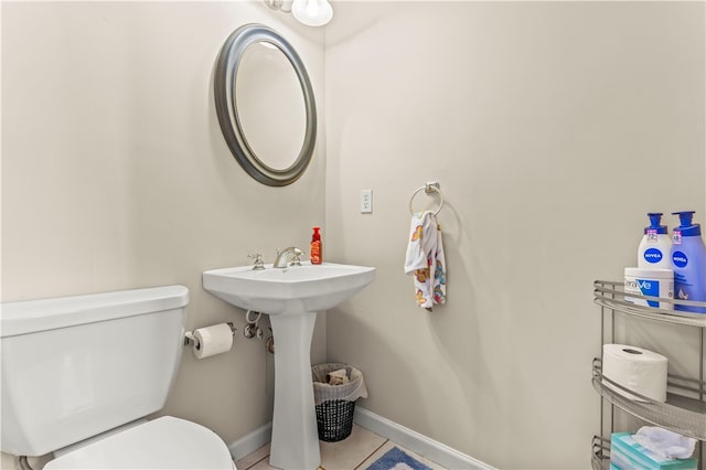 bathroom featuring tile patterned flooring and toilet